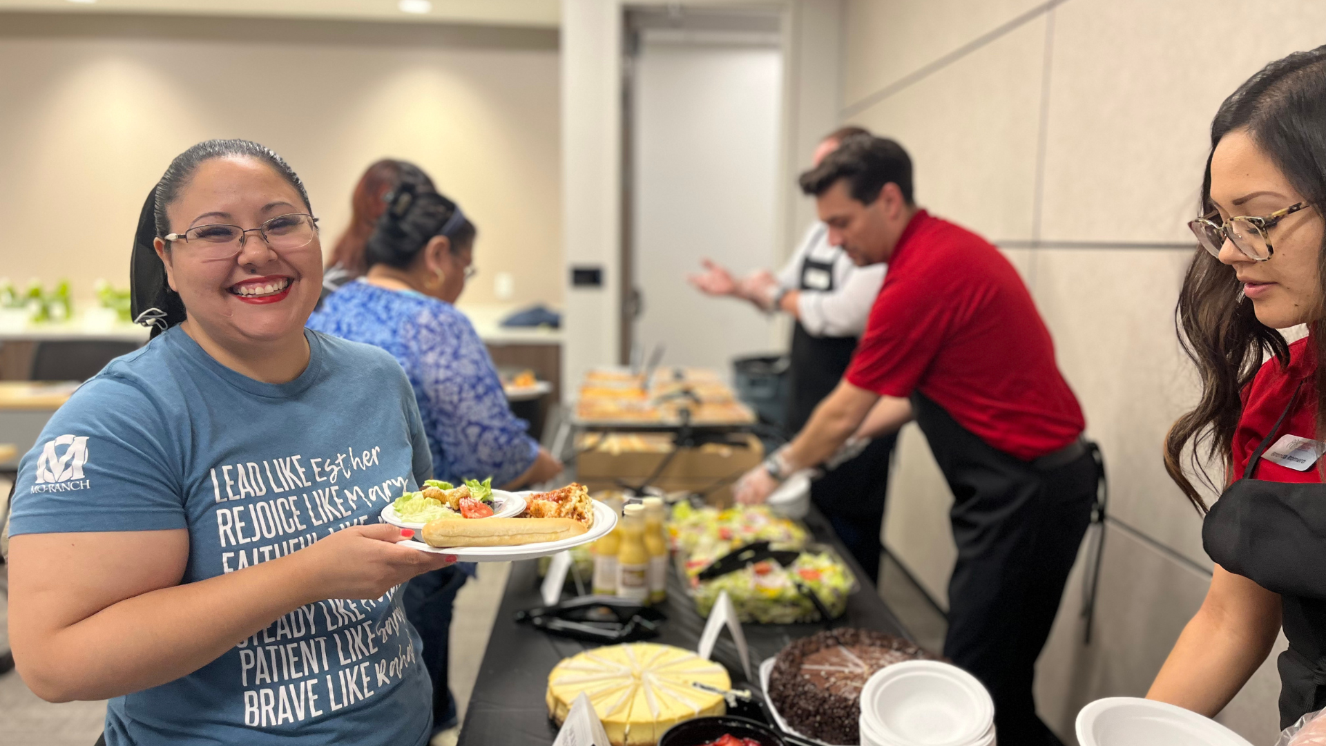 Member smiling at camera with her Olive Garden