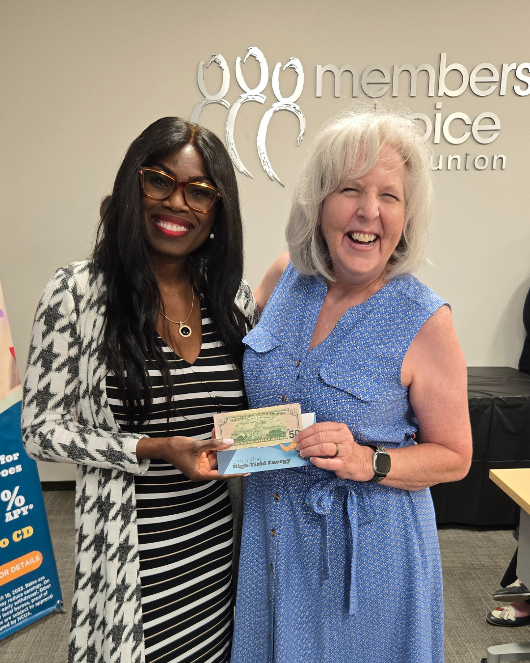 Winner of our $50 cash door prize posing with MCCU board member