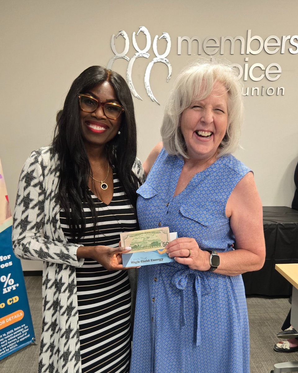 Winner of our $50 cash door prize posing with MCCU board member